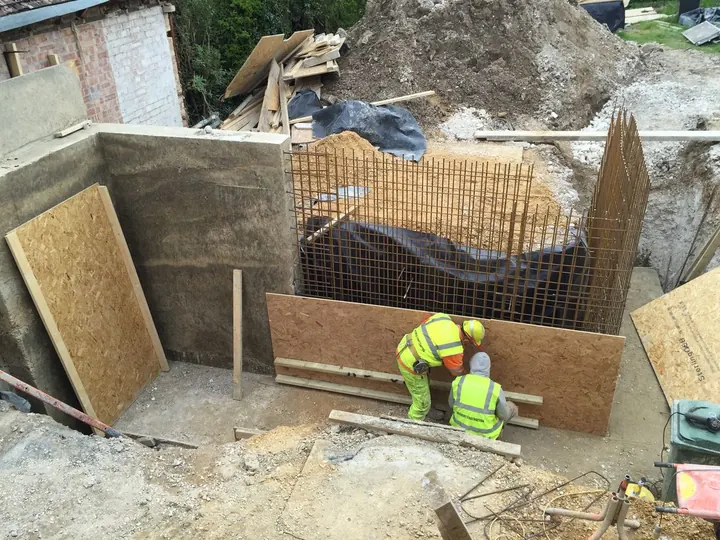 Steel reinforcement and shuttering for new basement walls in an excavation